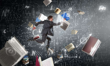 Happy businessman jumping high . Mixed media