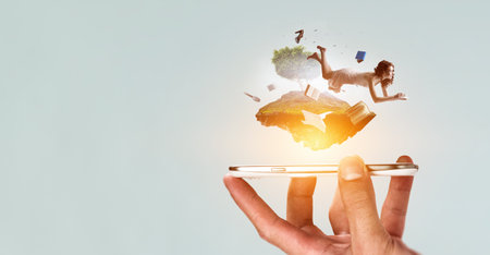 Young woman levitates while reading a bookの写真素材