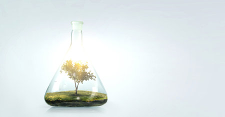 Tree growing inside clear glass bottle . Mixed media