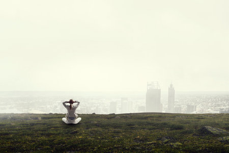 Portrait of thoughtful businesswoman sittingの写真素材