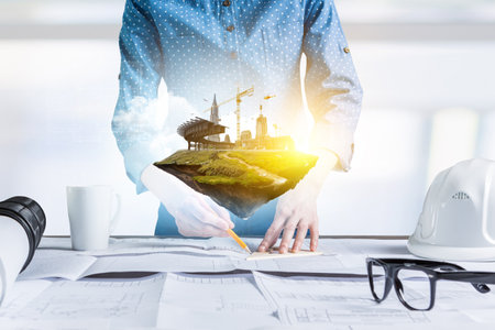 Construction industry concept with drafts and plans . Mixed mediaの写真素材