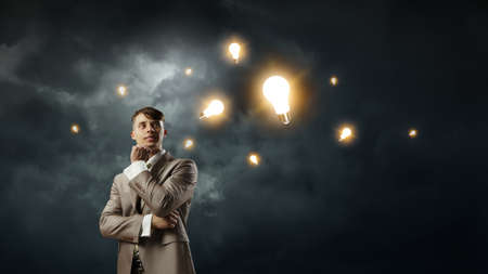 Thoughtful successful businessman . Mixed mediaの写真素材