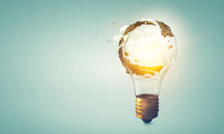 Green landscape inside light bulbの写真素材