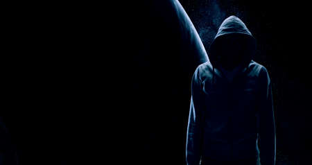 Silhouette of man in hoody