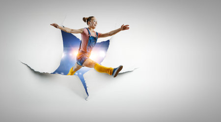 Young woman jumping in the air . Mixed mediaの写真素材