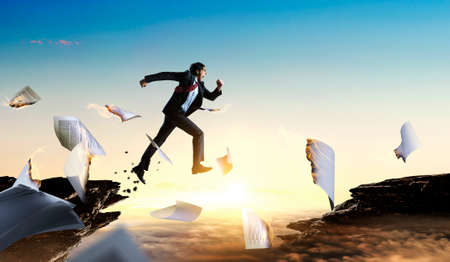 Portrait of energetic businessman running . Mixed media