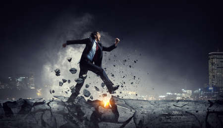 Portrait of energetic businessman running . Mixed media