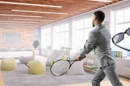 Businessman playing tennis . Mixed mediaの写真素材