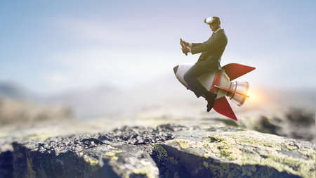 Businessman on a rocket . Mixed mediaの写真素材