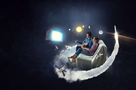 Young couple watching 3D movie . Mixed media