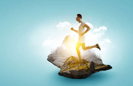 Man in sportwear running . Mixed mediaの写真素材