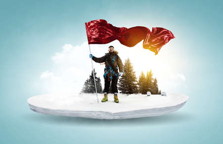 Mountaineer with a red flagの写真素材