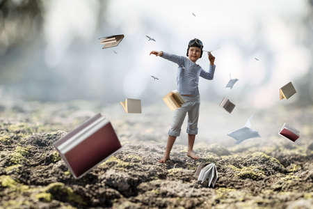Happy kid playing with paper airplane