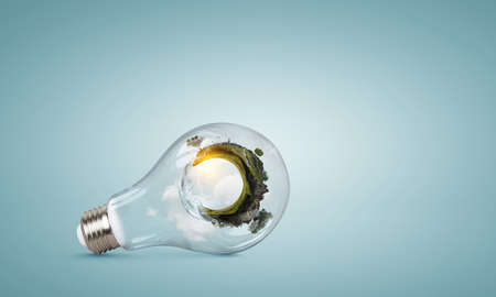 Green landscape inside light bulb