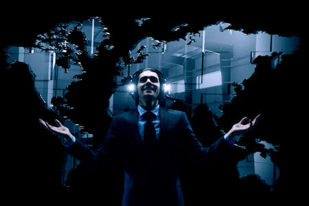 Young businessman with headphones . Mixed mediaの写真素材