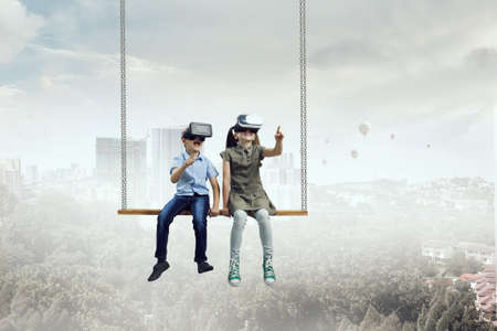 Kids wearing virtual reality goggles