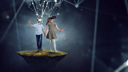 Kids wearing virtual reality goggles