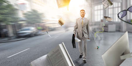 Young businessman walking towards successの写真素材