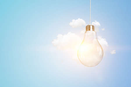 Light bulb on light blue backgroundの写真素材