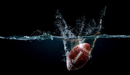 Football ball in water . Mixed mediaの写真素材