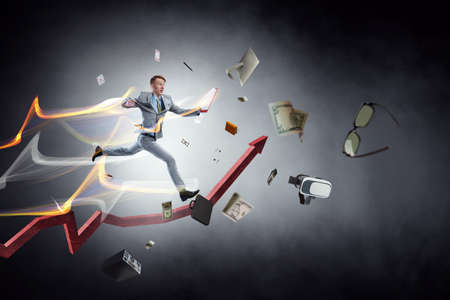 Portrait of energetic businessman jumping in open air