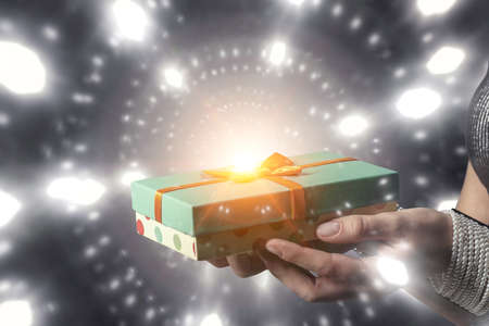 Closeup hands giving surprise gift box