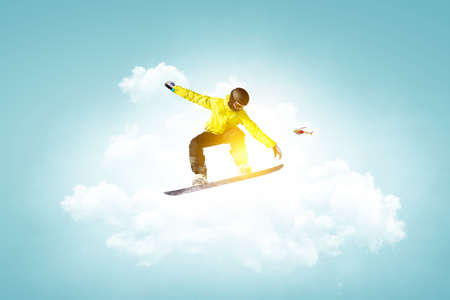 Snowboarder and Alps landscapeの写真素材
