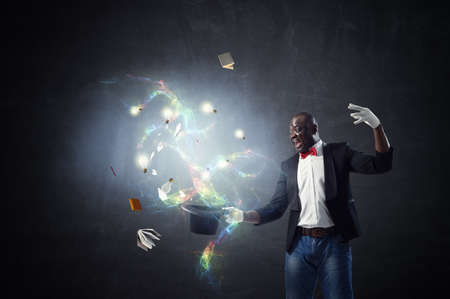 Male illusionist performing tricksの写真素材