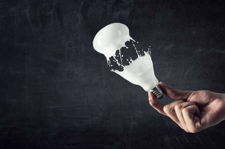 Light bulb with white glass splash . Mixed media