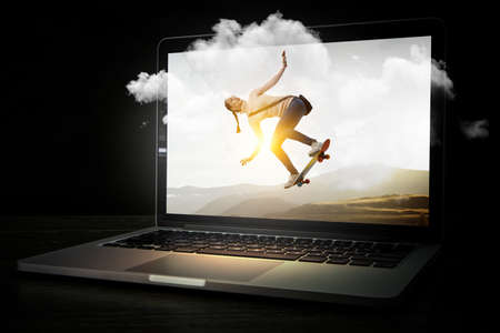 Young woman riding her skateboardの写真素材