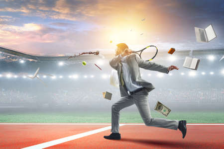 Businessman playing tennis . Mixed mediaの写真素材
