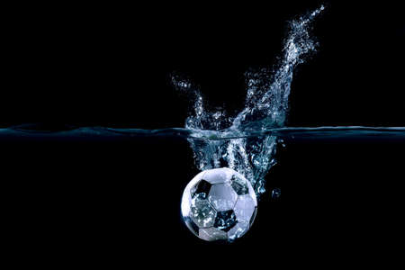 Football ball in water . Mixed media