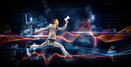 Portrait of energetic businessman jumping in open air
