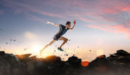 Man in sportwear running . Mixed mediaの写真素材