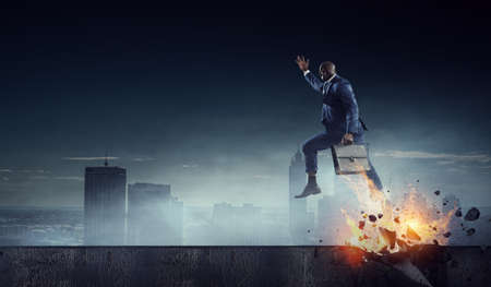 Determined businessman on his way to success leaving fire trailsの写真素材