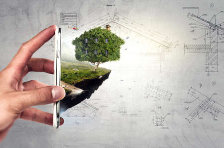 Hand holding green house . Mixed media