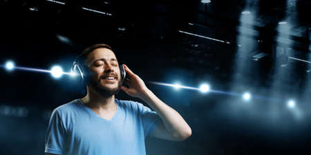 Young man with headphones . Mixed mediaの写真素材