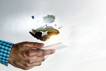 Smartphone and books . Mixed mediaの写真素材