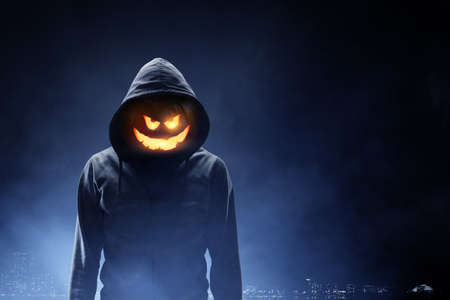 Scary and creepy male monster with gouged eyes looking like a skullの写真素材