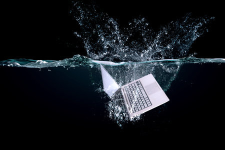 Keyboard dropped into water . Mixed mediaの写真素材