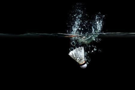 Shuttlecock in water . Mixed mediaの写真素材