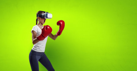 Young woman boxing in VR glassesの写真素材