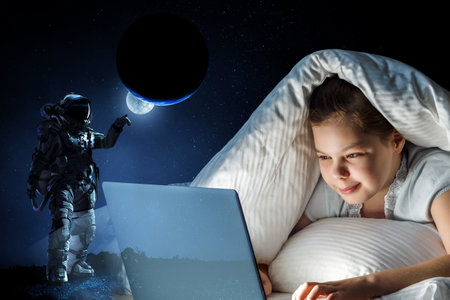 Little girl in front of computerの写真素材