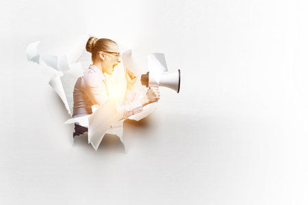 Woman with megaphone . Mixed mediaの写真素材