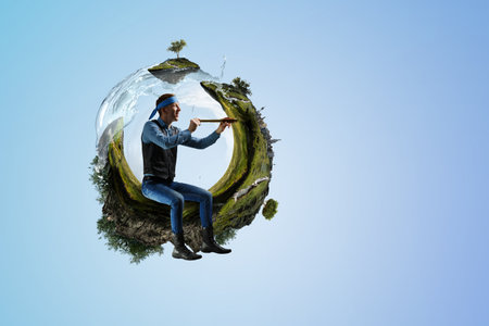 Young man looking through spyglass