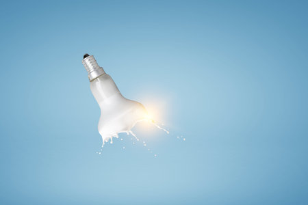Light bulb with white glass splashの写真素材