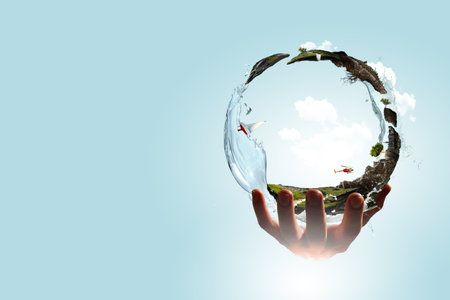 Green sphere landscape with grass and clear waterの写真素材