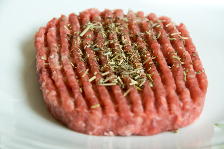 chopped steak isolates closeup with provence grass