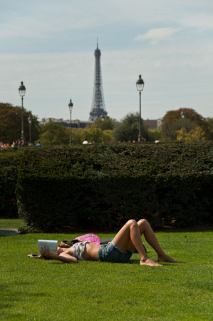 sexy girl on grass on Tuileries garden in Parisの写真素材