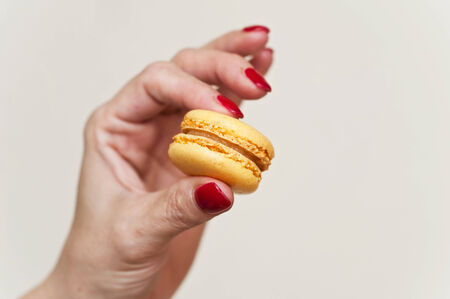 Woman  hand with macaronの写真素材